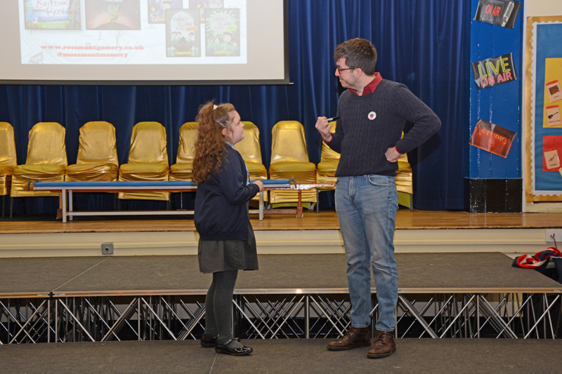 Pupil chatting with an author